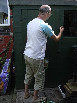 Me painting the shed green