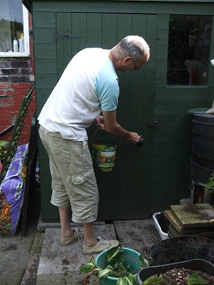 Me painting the shed green