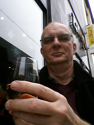 Me drinking sherry outside at Lunya