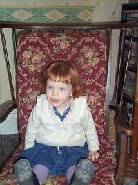 Mary in her great grandma's rocking chair