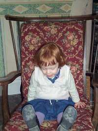 Mary in her great grandma's rocking chair