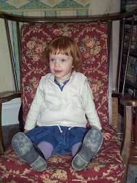 Mary in her great grandma's rocking chair